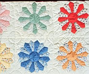 Quilt with multi-colored sunflowers