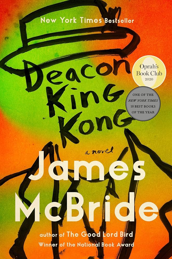 Vibrant cover with abstract painted background in orange, yellow, and green tones. Bold black brushstroke-style text spells out Deacon King Kong with white text below reading James McBride. Includes circular badges noting New York Times Bestseller, Oprah's Book Club 2020, and One of the New York Times 10 Best Books of the Year.