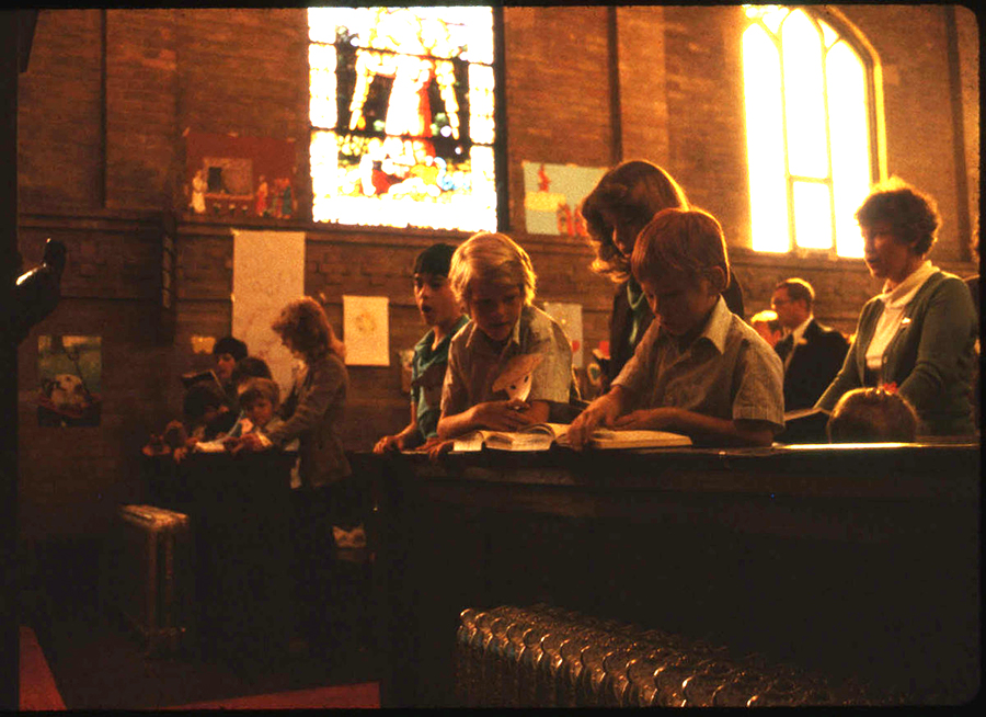 People in church with books