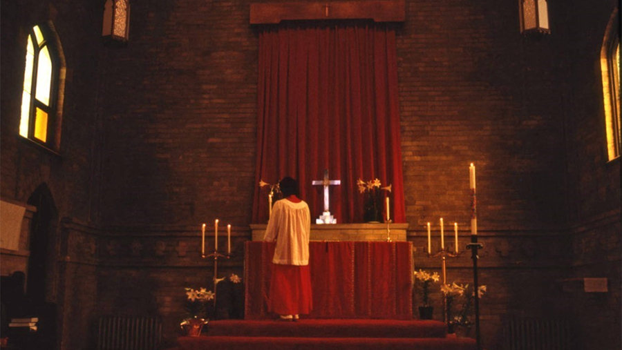 The inside of St John's Episcopal Church during a service in the 1970s
