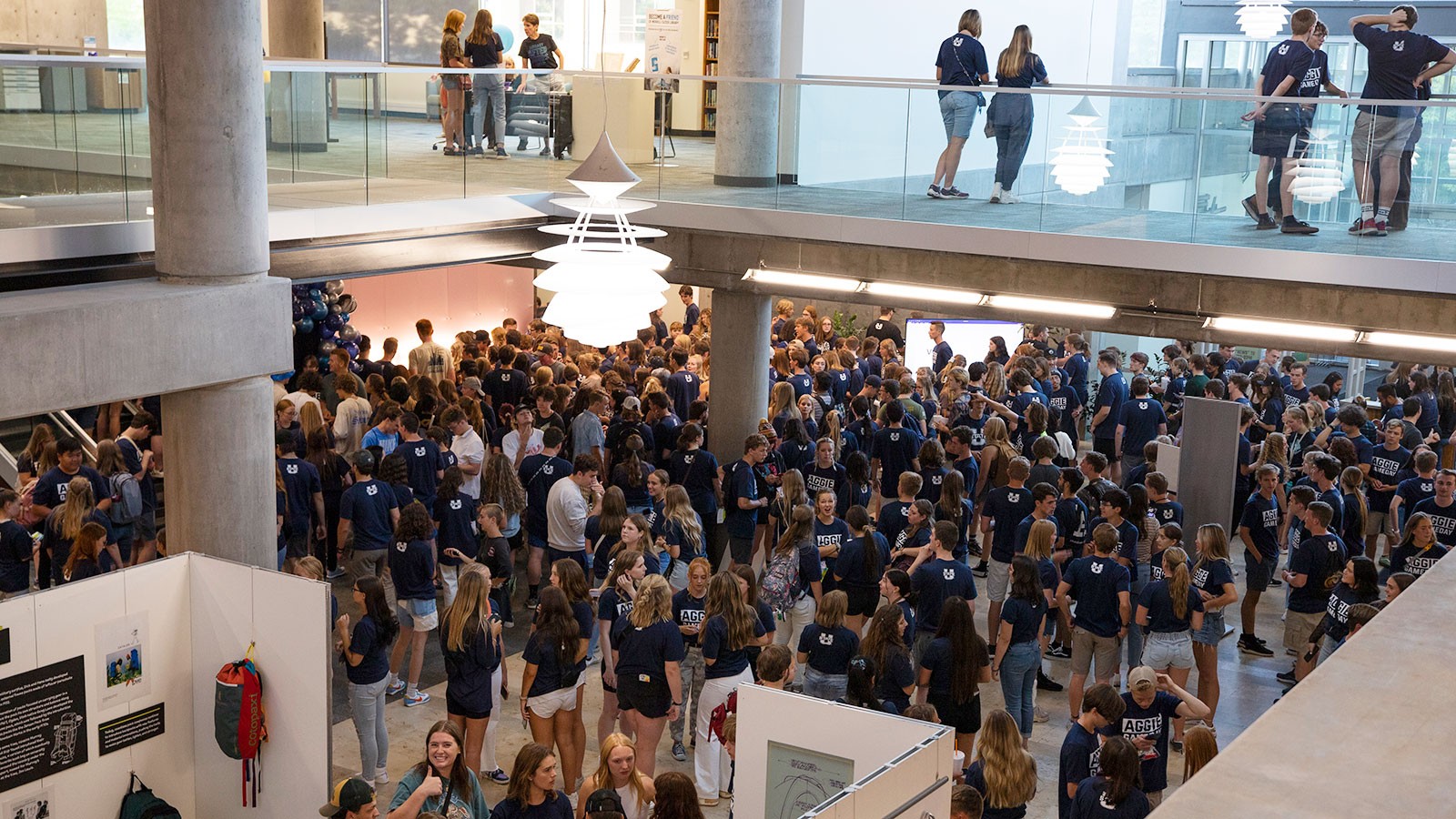 Students gather in the library atrium